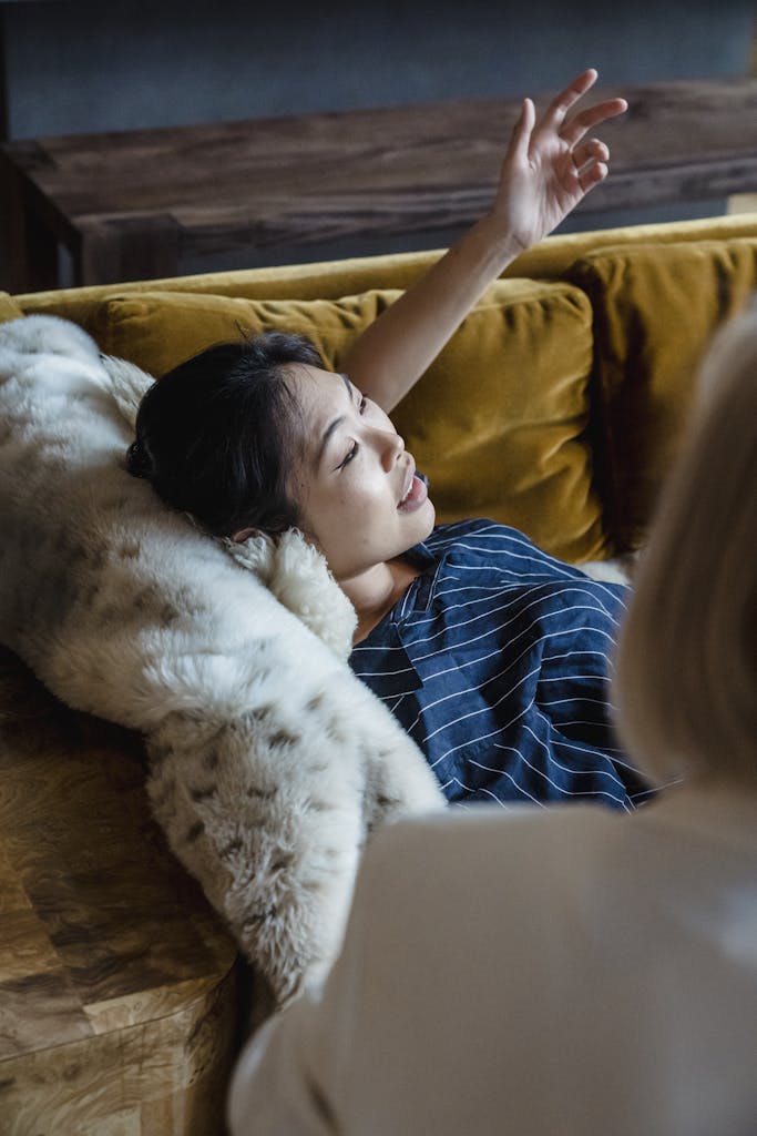 A therapist and a patient in an engaging therapy session discussing emotions and mental health.